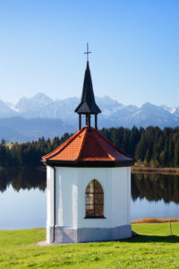 Chapel at the Hergratsrieder lake with Allgäu Alps, near Füssen, Allgäu, Bavaria, Germany Chapel at the Hergratsrieder lake with Allgäu Alps, near Füssen, Allgäu, Bavaria, Germany